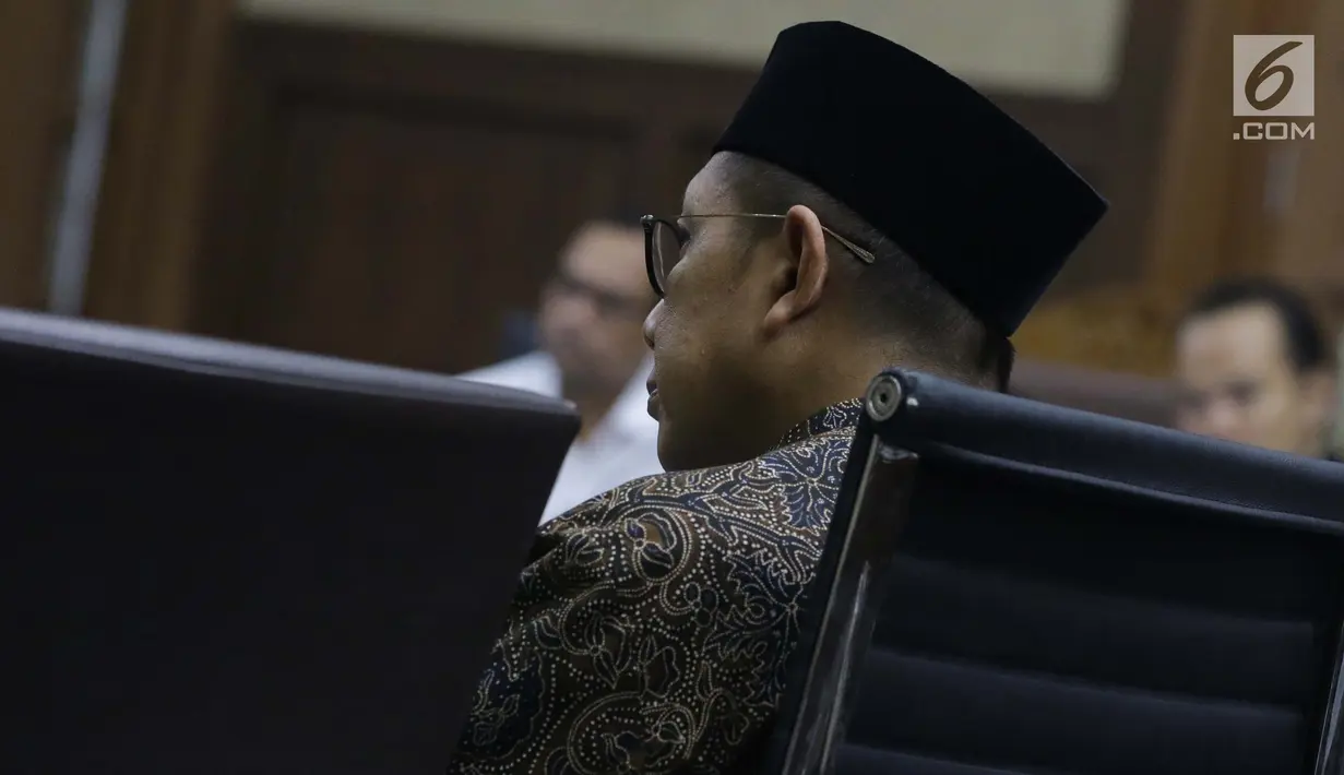 Menteri Agama, Lukman Hakim Syaifuddin jelang memberi keterangan sebagai saksi di Pengadilan Tipikor, Jakarta, Rabu (26/6/2019). Lukman Hakim Syaifuddin memberi keterangan sebagai saksi pada sidang lanjutan suap seleksi pengisian jabatan di Kementerian Agama. (Liputan6.com/Helmi Fithriansyah)