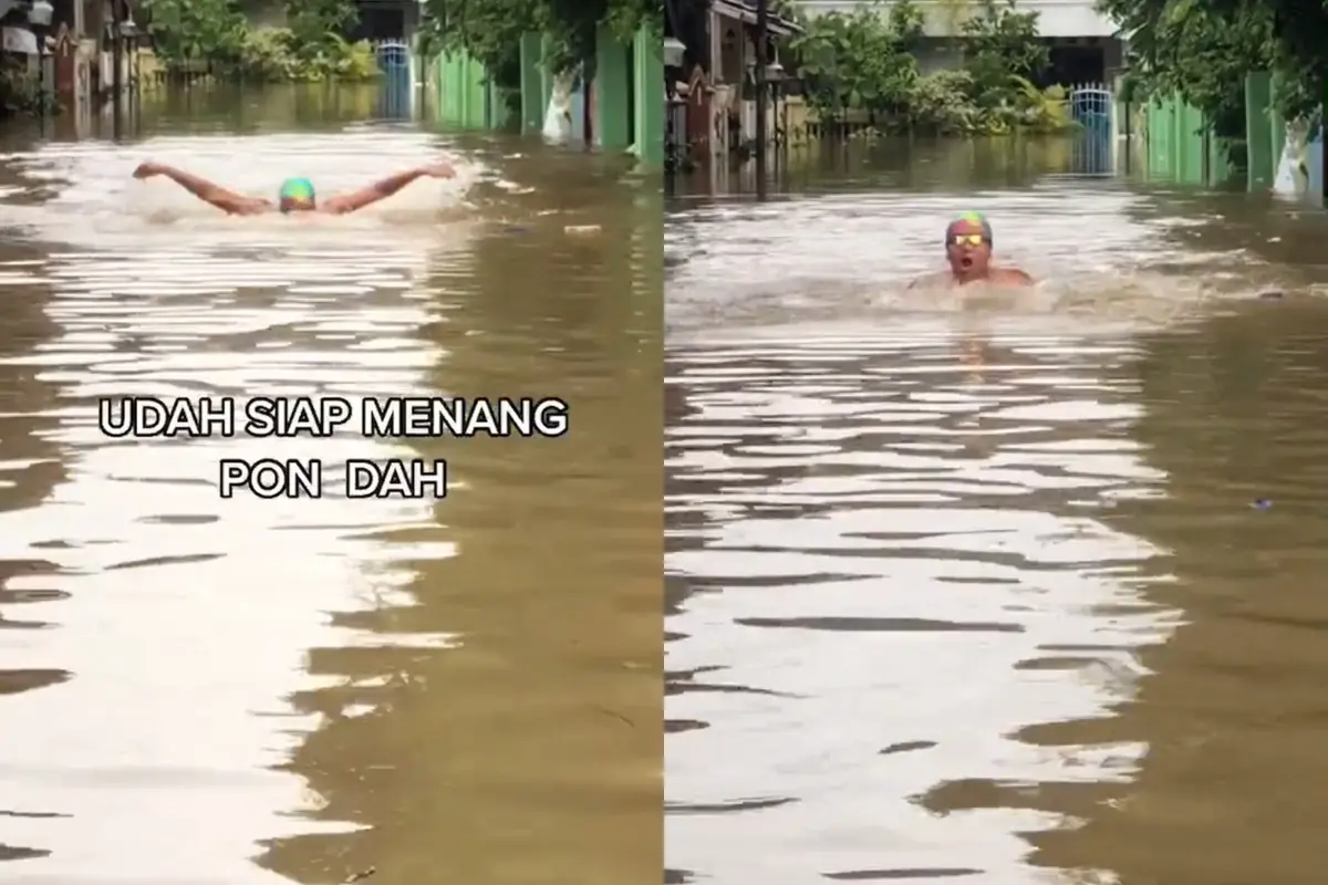 Video viral yang menunjukkan seorang pemuda unjuk kemampuannya berenang di tengah banjir.