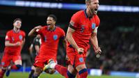 Harry Kane melakukan selebrasi usai mencetak gol pada pertandingan sepak bola UEFA Nations League antara Inggris dan Jerman di Stadion Wembley di London, Inggris, Selasa, 27 September 2022 dini hari WIB. (AP Photo/Alastair Grant)