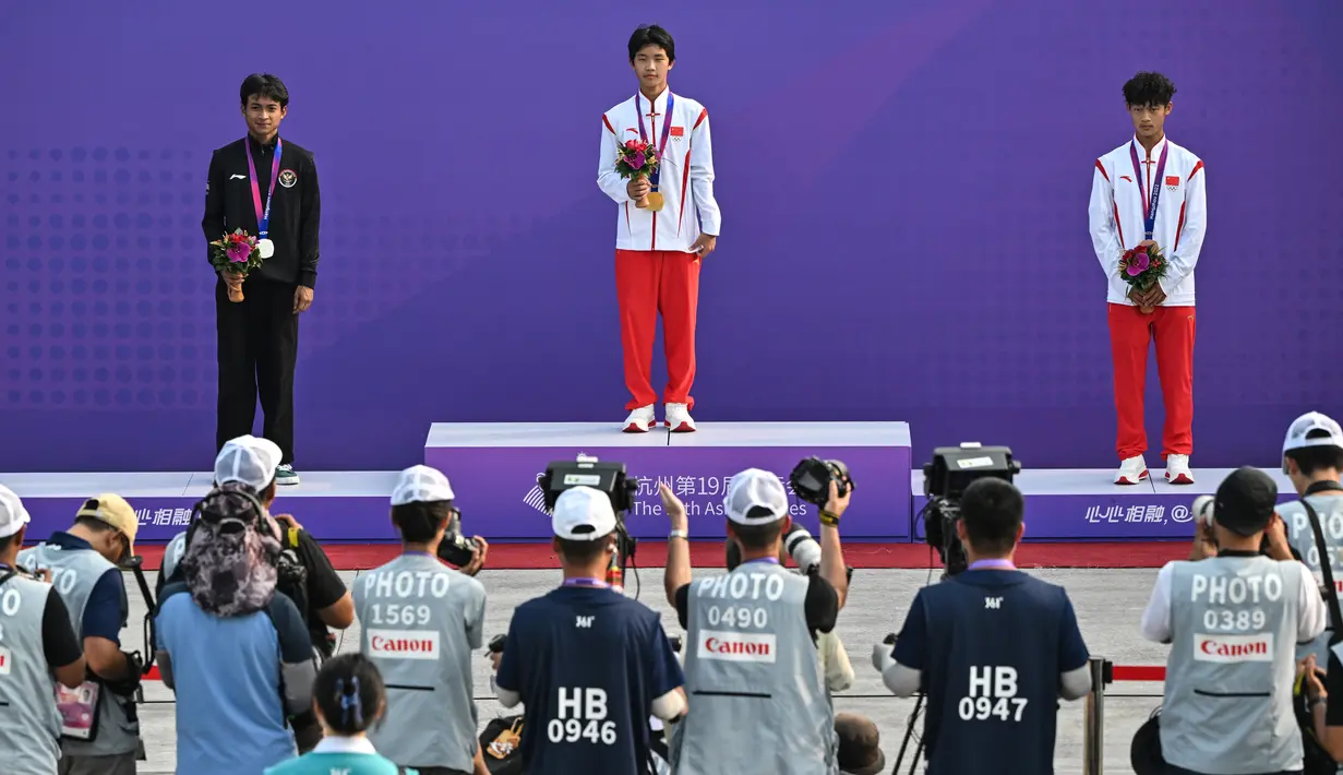 Sanggoe juga berhasil mengalahkan Ginu Onodera, peringkat ketiga dunia asal Jepang. (Photo by Hector RETAMAL / AFP)