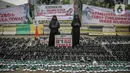 Massa melakukan aksi di depan Kedutaan Besar Amerika Serikat, Jakarta, Senin (15/1/2024). Dalam aksi memperingati 100 hari genosida Gaza tersebut mengecam 9.280 lebih tewasnya anak-anak Gaza, Palestina. (Liputan6.com/Faizal Fanani)
