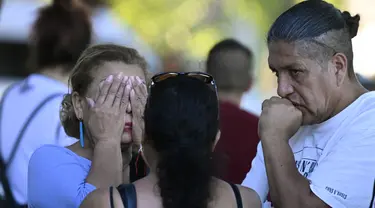 Reaksi ibu dari salah satu korban, yang tewas dalam kebakaran di sebuah klub malam tempat ia merayakan ulang tahunnya di Murcia, Spanyol di mana mereka telah menerima bantuan psikologis, pada 1 Oktober 2023. (JOSE JORDAN / AFP)