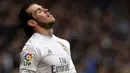 Gelandang Real Madrid, Gareth Bale, murung meski menang melawan Deportivo pada laga La Liga Spanyol. Terakhir kali El Real meraih titel La Liga terjadi saat kepelatihan Jose Mourinho pada musim 2011/12. (AFP/Miguel Riopa)