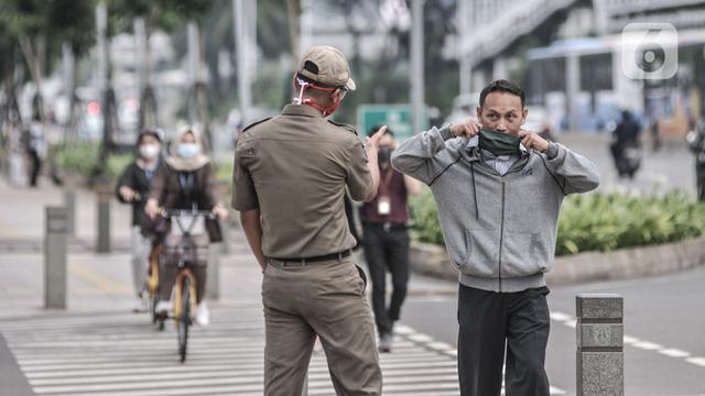 FOTO: Pembatasan 25 Persen Pekerja Kantoran di Jakarta