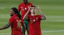Bek Portugal, Joao Cancelo melakukan selebrasi usai mencetak gol ketiga Portugal ke gawang Israel dalam laga uji coba menjelang Euro 2020 di Jose Alvalade Stadium, Lisbon, Rabu (9/6/2021). Portugal menang 4-0 atas Israel. (AP/Armando Franca)