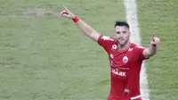 Striker Persija Jakarta, Marko Simic, melakukan selebrasi usai membobol gawang Mitra Kukar pada laga Liga 1 di SUGBK, Jakarta, Minggu (09/12). Persija Jakarta menang 2-1 atas Mitra Kukar. (Bola.com/M Iqbal Ichsan)