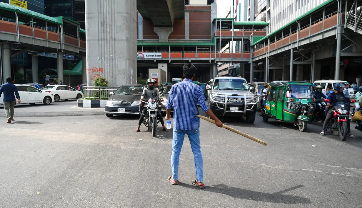 <p>Daerah-daerah utama di ibu kota seperti Badda, Rampura, Malibagh, Shantinagar, Paltan, Kakrail, dan persimpangan Gulistan terlihat tanpa kehadiran polisi lalu lintas pada hari Selasa. (Munir Uz Zaman / AFP)</p>