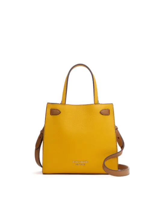 Seperti koleksi tas dan small leather goods untuk musim panas yang diwarnai berbagai tekstur dan motif playful, seperti polka dot, checks, dan stripes. (Foto: Kate Spade New York)