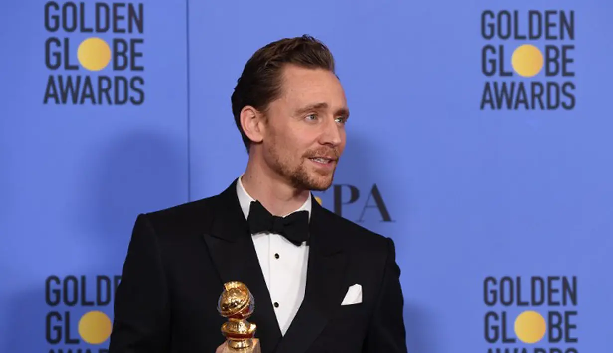 Malam penganugerahan Golden Globe 2017 nampaknya berujung tidak enak untuk Tom Hiddleston. Tom merasa bersalah dengan ucapannya saat berpidato, ia pun memohon maaf dan memberikan klarifikasinya. (AFP/Bintang.com)