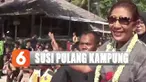 Saking banyaknya warga yang datang menyambut membuat Susi harus dikawal menuju mobil yang telah disiapkan.