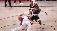 Duel Denver Nuggets melawan LA Lakers pada gim ketiga final NBA Wilayah Barat di AdventHealth Arena at the ESPN Wide World Of Sports Complex, Rabu (23/9/2020) pagi WIB. (Mike Ehrmann / Getty Images via AFP)