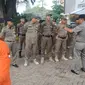 Anggota Satpol PP melakukan penertiban PMKS di wilayah Kota Depok. (Foto: Dokumentasi Satpol PP Depok)