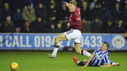 Manchester United menang 2-0 di kandang Wigan. (AP Photo/Jon Super)