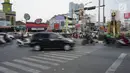 Kondisi lalu lintas di lampu merah persimpangan Ramanda, Depok, Jawa Barat, Rabu (14/8/2019). Pemutaran lagu Wali Kota Depok Mohammad Idris di lampu merah tersebut sebagai bagian dari konsep Joyful Traffic Management (Jotram). (Liputan6.com/Immanuel Antonius)