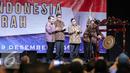 Presiden Joko Widodo memukul gong saat pembukaan Musyawarah Nasional IV Adkasi, Jakarta, Kamis (17/12). Musyawarah nasional ini bertema 'Membangun Indonesia Dari Daerah' dengan dihadiri DPRD Kabupaten seluruh Indonesia. (Liputan6.com/Faisal R Syam)