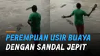 Aksi mengejutkan ditunjukkan perempuan saat didatangi buaya di pinggir sungai. Kejadian itu terjadi di sekitar Taman Nasional Kakadu di Northern Territory, Australia.
