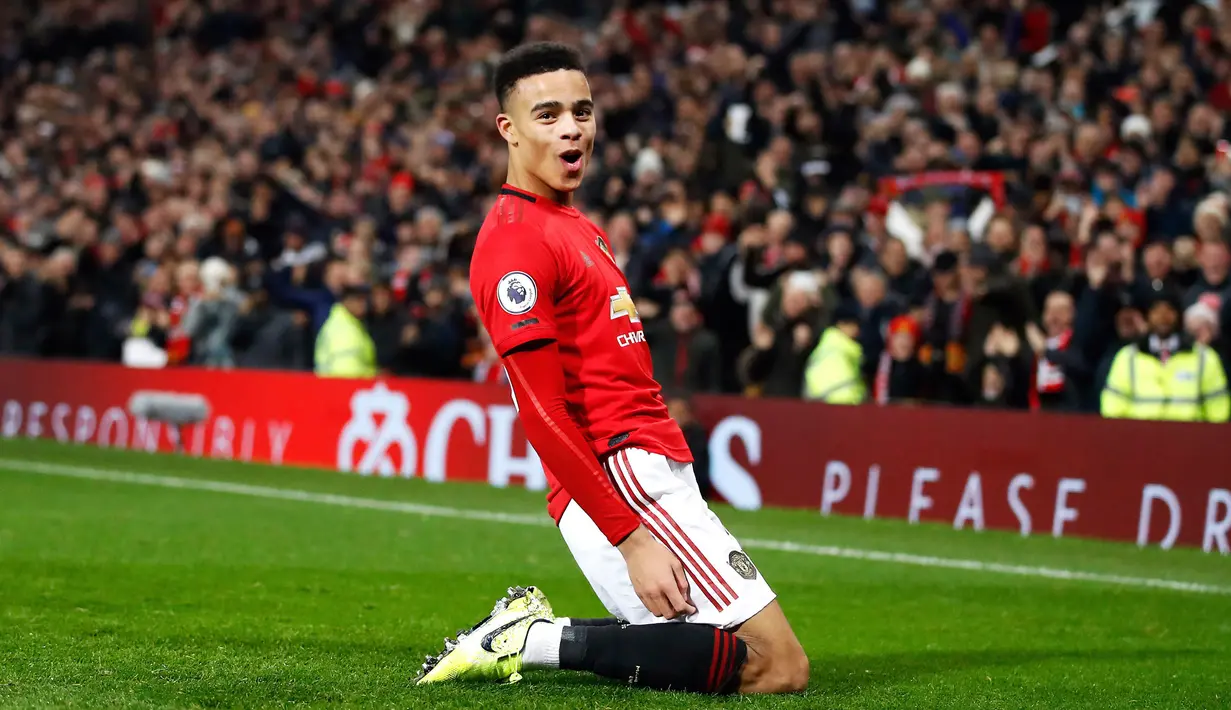 Pemain Manchester United Mason Greenwood merayakan golnya ke gawang Newcastle United pada pertandingan Liga Inggris di Old Trafford, Manchester, Inggris, Kamis (26/12/2019). Manchester United menang 4-1 atas Newcastle United. (Martin Rickett/PA via AP)