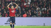 Gelandang Lille, Ethan Mbappe, berselebrasi setelah mencetak gol ke gawang Paris Saint-Germain di  Stade Pierre-Mauroy, Villeneuve-d'Ascq, Senin (6/10/2025) dini hari WIB. (Sameer Al-Doumy/AFP)