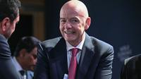 Presiden FIFA, Gianni Infantino, bereaksi saat resepsi dengan para pemimpin bisnis di sela-sela pertemuan tahunan Forum Ekonomi Dunia (WEF) di Davos pada 21 Januari 2026. Forum Ekonomi Dunia berlangsung di Davos dari 19 Januari hingga 23 Januari 2026. (Mandel NGAN/AFP)