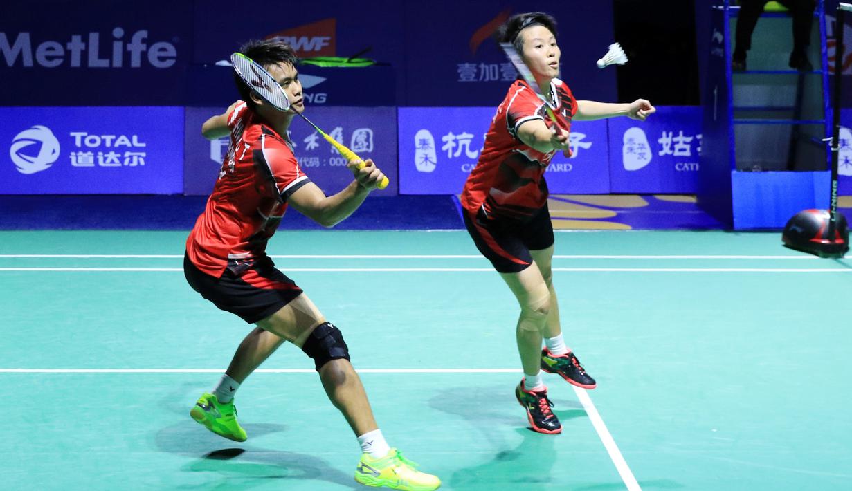 Ganda campuran Indonesia, Tontowi Ahmad/Liliyana Natsir, menyegel gelar juara China Terbuka Super Series Premier usai membungkam pasangan baru China, Zhang Nan/Li Yinhui. (PBSI)