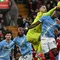 Kiper Manchester City asal Italia bernomor punggung 25, Gianluigi Donnarumma (ke-3 dari kiri), menghalau bola selama pertandingan Liga Inggris antara Liverpool dan Manchester City di Anfield, Liverpool, barat laut Inggris pada 8 Februari 2026. (Paul ELLIS/AFP)