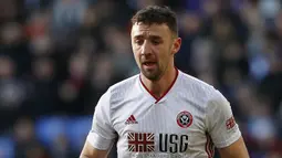 Enda Stevens - Bek berusia 29 tahun ini tampil begitu apik di lini belakang Sheffield United pada musim ini. Stevens memiliki catatan 150 kemenangan duel dan 59 persen keberhasilan dalam tackle. (AFP/Ian Kington)