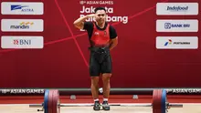 Lifter andalan Indonesia, Eko Yuli Irawan, yang beraksi di cabang angkat besi putra 62 kg, merebut medali emas Asian Games 2018 di arena JIEXPO, Jakarta, Selasa (21/8/2018). (AFP/Money Sharma)