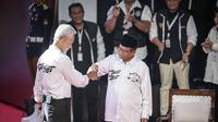 Pasangan Capres-Cawapres nomor urut 3, Ganjar Pranowo dan Mahfud Md menghadiri debat Pilpres 2024 di Kantor KPU, Jakarta Pusat, Selasa (12/12/2023) malam. (Liputan6.com/Faizal Fanani)