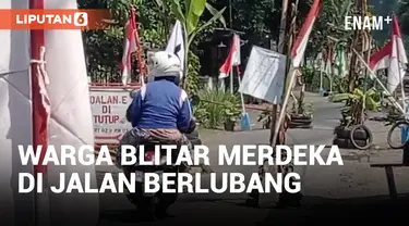 Protes Jalan Rusak, Warga Blitar Pasang Bendera Indonesia di Jalan Berlubang