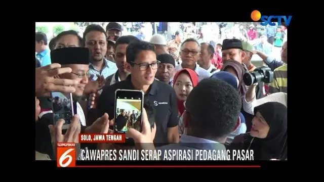 Cawapres Sandiaga Uno, didampingi Ketua MPR Zulkifli Hasan, berinteraksi dengan pedagang Pasar Kadipolo di Solo, Jawa Tengah.