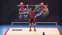 Lifter Indonesia, Ketut Ariana, menyumbangkan medali emas dari kelas 77 kg pada SEA Games 2017, Selasa (29/8/2017). (Vidio.com)