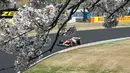 Pembalap Monegasque Ferrari, Charles Leclerc, melaju saat sesi latihan pertama Grand Prix Jepang Formula Satu di sirkuit Suzuka, prefektur Mie pada 4 April 2025. (MOHD RASFAN/AFP)