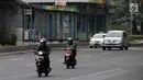 Pengendara sepeda motor melintasi Jalan MH Thamrin-Medan Merdeka Barat, Jakarta Pusat, Kamis (11/1). Mahkamah Agung (MA) membatalkan Pergub DKI tentang larangan sepeda motor melintas di jalan tersebut. (Liputan6.com/Arya Manggala)