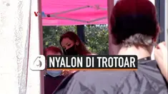 nyalon di trotoar