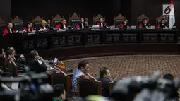 Suasana saat Ketua Kuasa Hukum KPU untuk Pilpres, Ali Nurdin memberikan keterangan dalam sidang sengketa Pilpres 2019 di Gedung MK, Jakarta, Selasa (18/6/2019). Sidang tersebut beragendakan mendengarkan jawaban dari termohon. (Liputan6.com/Faizal Fanani)