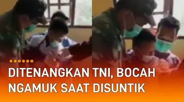 Seorang bocah laki-laki berseragam Sekolah Dasar (SD) ngamuk ketika hendak disuntik.