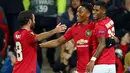 Striker Manchester United (MU), Anthony Martial berselebrasi dengan rekannya, Juan Mata dan Marcus Rashford setelah mencetak gol ke gawang Partizan pada matchday keempat Grup L Liga Europa di Old Trafford, Kamis (7/11/2019). MU mengalahkan Partizan Belgrade 3-0. (AP/Dave Thompson)