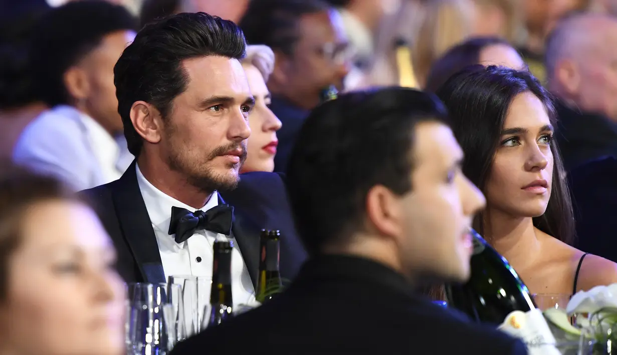 James Franco dan kekasihnya, Isabel Pakzad menghadiri Screen Actors Guild Awards di Los Angeles, Minggu (21/1). Pekan lalu Franco melewatkan Critic’s Choice Awards, padahal dirinya memenangi penghargaan sebagai Aktor Komedi Terbaik. (Christopher Polk/AFP)