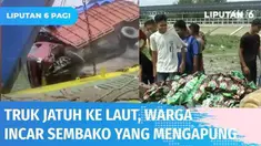 Truk pengangkut sembako jatuh ke laut saat akan masuk ke kapal penyeberangan di Pelabuhan Meulaboh, Aceh Barat. Sebagian besar muatan sembako hilang dan tenggelam di laut. Warga incar sembako yang masih terapung.