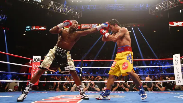 Floyd Mayweather Berhasil Taklukan Manny Pacquiao