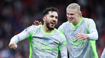 Pemain Manchester City, Rayan Cherki, bersama Erling Haaland merayakan gol ke gawang Nottingham Forest pada laga pekan ke-18 Premier League di Stadion The City Ground, Sabtu (27/12/2025). (Barrington Coombs/PA via AP)