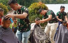 TNI Fasilitasi Cukur Rambut Gratis di Taput, Bangkitkan Semangat Anak Terdampak Bencana