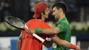 Pertandingan ini terbukti lebih mudah dibandingkan pertemuan sebelumnya yang terjadi di babak keempat di Roland Garros tahun lalu. Dalam pertemuan itu, Musetti mampu menyulitkan Djokovic hingga set kelima. (AP/Kamran Jebreili)