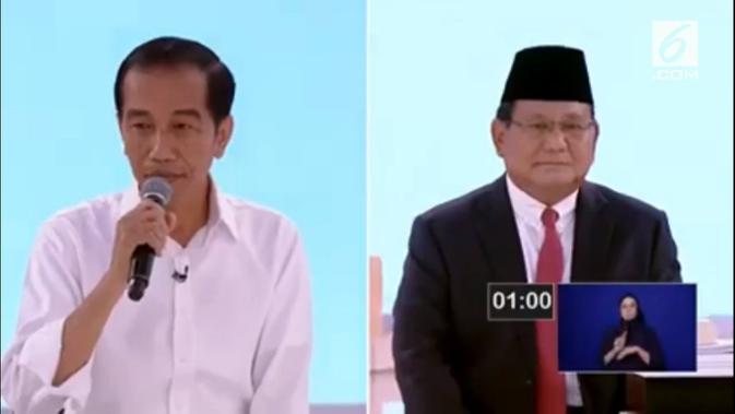 Jokowi dan Prabowo Subianto dalam debat kedua capres 2019. ()