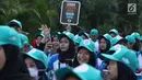 Peserta kampanye cegah stunting membawa tulisan saat berjalan di kawasan Bundaran Hotel Indonesia, Jakarta, Minggu (16/9). Kampanye ini bertujuan mengurangi penderita stunting di Indonesia. (Liputan6.com/Helmi Fithriansyah)