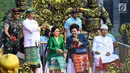 Presiden Joko Widodo didampingi Ibu Negara Iriana mengenakan pakaian adat saat menghadiri pawai pembukaan Pesta Kesenian Bali (PKB) ke-40 di Bali (23/6). (Liputan6.com/Pool/Biro Pers Setpres)