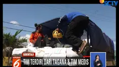 Tim dinsos mengisi belasan truk dengan bahan makanan siap saji, pakaian, dan beberapa bahan lain yang diperkirakan berguna bagi korban gempa.