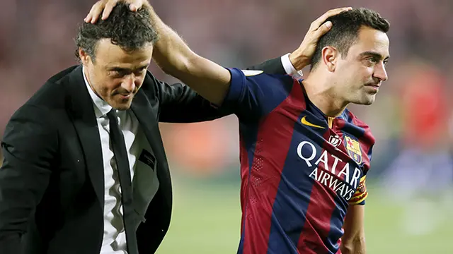 Ekspresi Luis Enrique dengan XaviHernandez