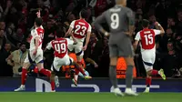 Gelandang Arsenal asal Spanyol, Mikel Merino (tengah), merayakan gol ketiga timnya selama pertandingan leg pertama perempat final Liga Champions UEFA antara Arsenal dan Real Madrid, di Stadion Emirates, London, pada 8 April 2025.Adrian Dennis / AFP