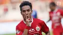 Pemain tengah Persija, Novri Setiawan merayakan gol ke gawang Arema FC pada lanjutan Shopee Liga 1 Indonesia 2019 di Stadion Gelora Bung Karno, Jakarta, Sabtu (3/8/2019). Laga berakhir imbang 2-2. (Liputan6.com/Helmi Fithriansyah)